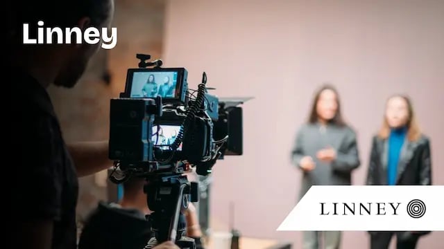 Linney case study thumbnail - woman standing in video studio-2