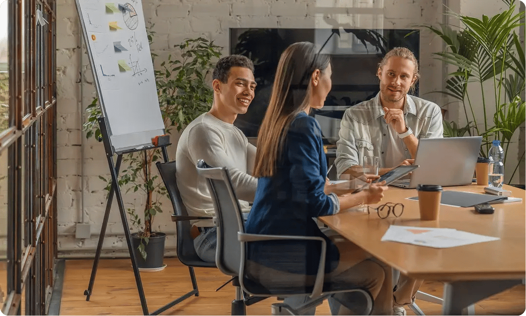 Creative studio team discussing client feedback during a project meeting