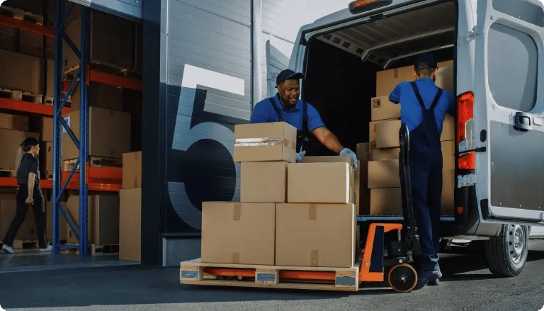 DynamiCard logistics team loading packaged orders into a delivery van