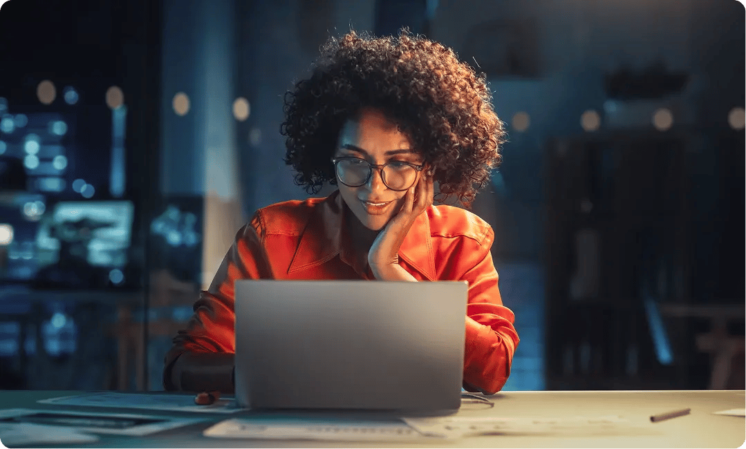 Creative professional reviewing digital content on a laptop