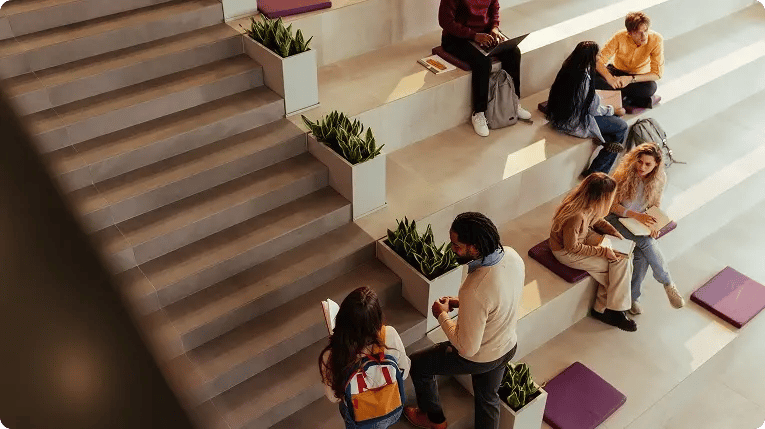 Students studying and collaborating in a campus common area