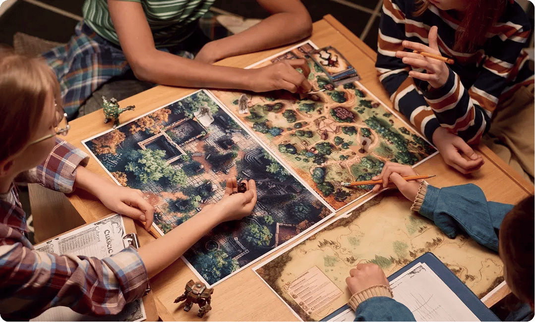 Players reviewing maps and game components during a tabletop game session