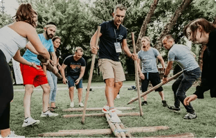 Ziflow CEO Anthony Welgemoed acting as a surfer on wooden logs-2