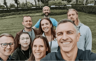 Ziflow CEO and employees standing by the camera-1