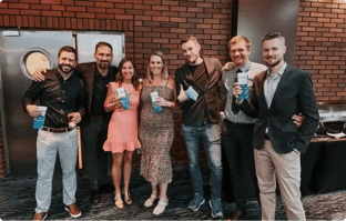 Ziflow team posing in a smart outifits at integration party-1